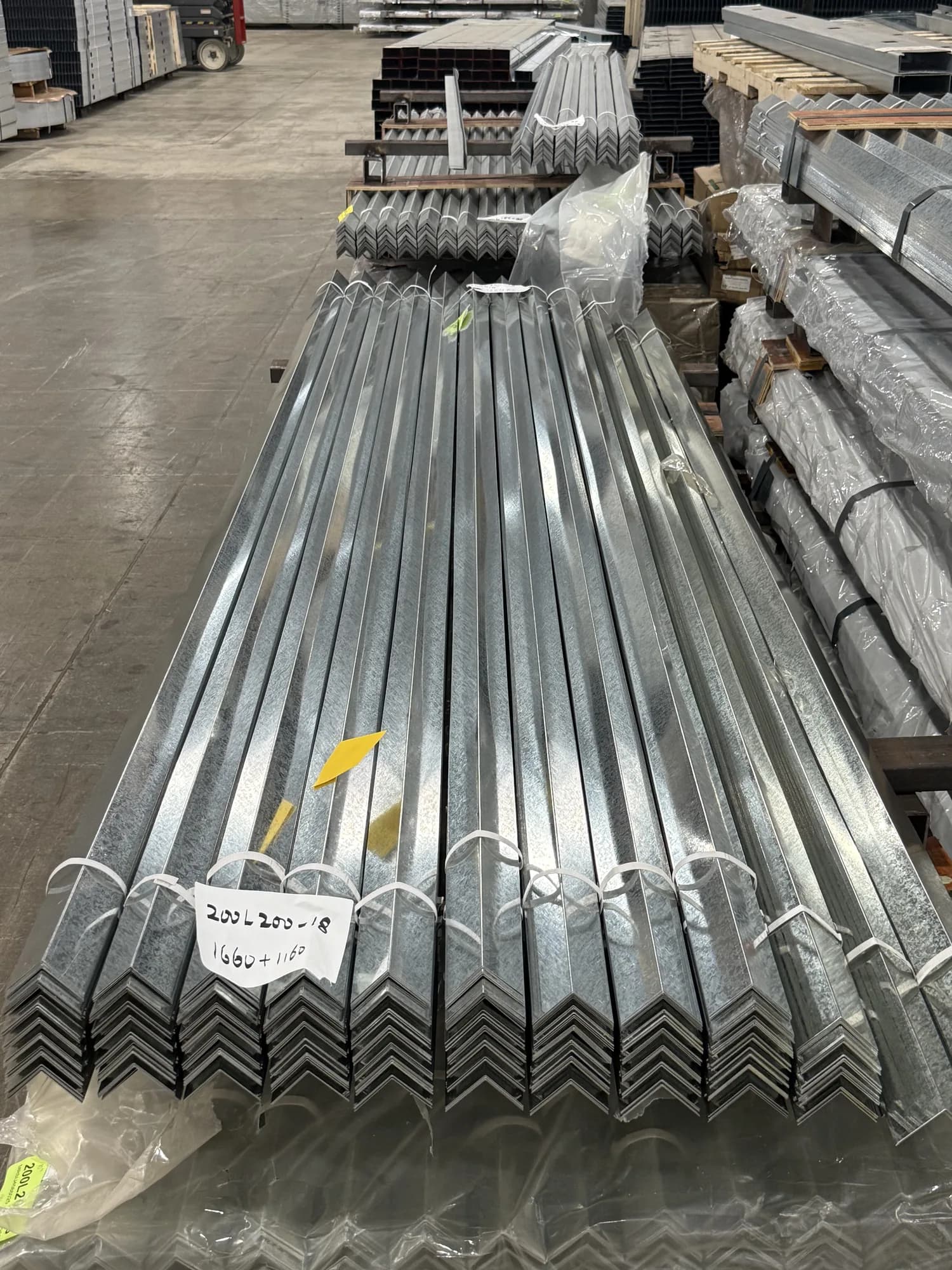 Bundle of galvanized L angle labelled 200L200-18